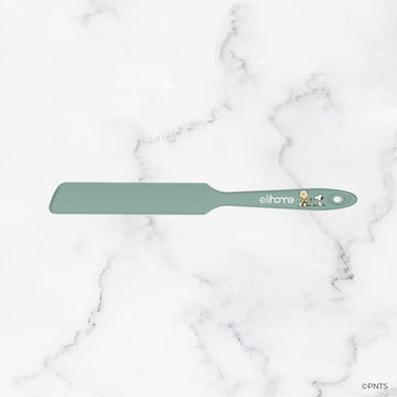 Green spatula with 'elihave' branding on a marble background