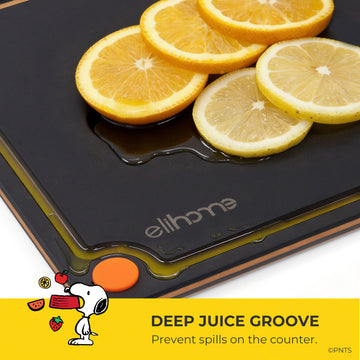Black cutting board with sliced oranges and lemons, featuring the 'elihome' brand.