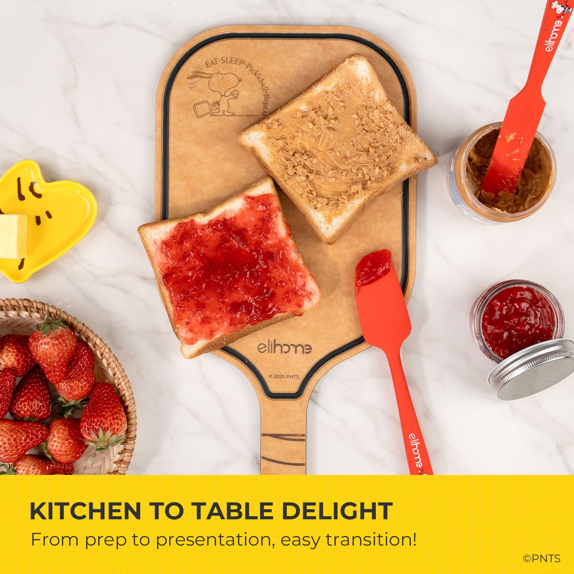 Wooden spatulas with toast and strawberry jam, surrounded by strawberries and a jar of jam on a white surface.