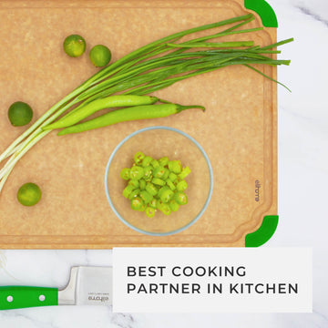 Overhead view of fresh green onions and peppers on a large fiber wood cutting board, presented as the best cooking partner in the kitchen for daily healthy meal preparation.